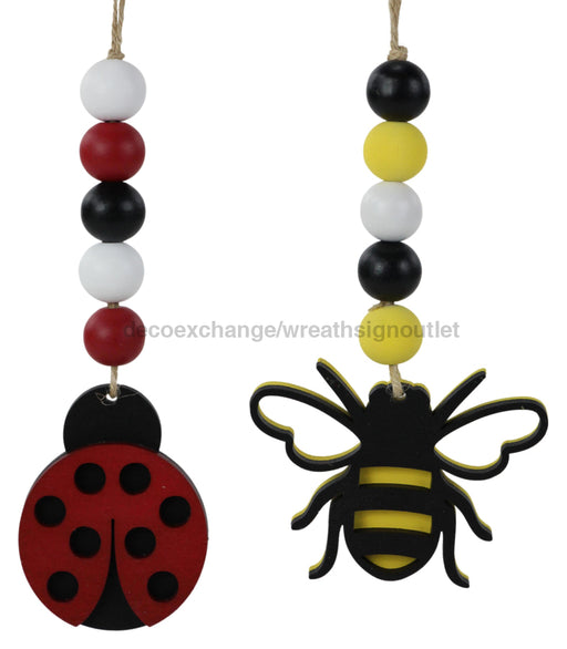 2 Asst 6.5’’L Wood Bead Bee/Ladybug Orn Yellow/Red/Black/White MS173799 Pick