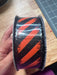 Org Stn/Blk Glt Diag Strp/Blk Tinsl Edg 1.5’’X10Y 51504-09-20 Ribbon