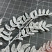 Xmas Leave Spray Wht 60905 Pick